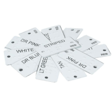 a pile of clothes labels with different clothing descriptors(e.g. "striped") printed in ink and braille