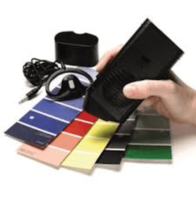 Talking Color detector reading the colors of a pile of blue, red, yellow, black, and green color swatches